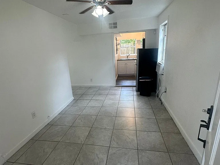 Main area leading to kitchen. Both bedroom are to the left.