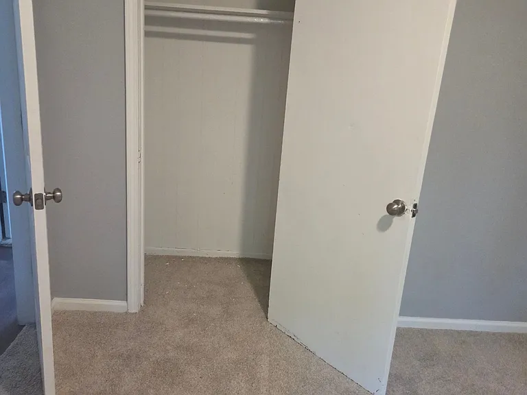 Functional bedroom closet designed to provide convenient storage for clothing, shoes, and everyday essentials. Featuring a built-in hanging rod, shelf space, and easy access from the bedroom, this closet helps maximize organization while maintaining a cle
