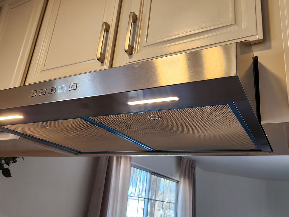Stainless vented hood with LED lighting and touch controls