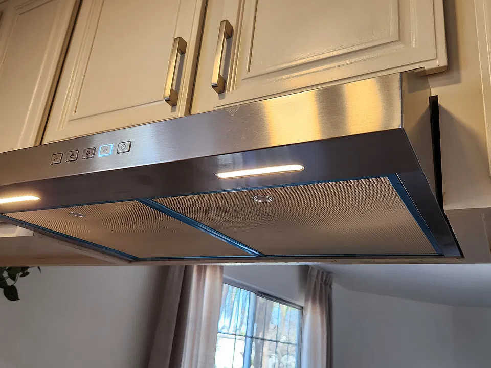 Stainless vented hood with LED lighting and touch controls