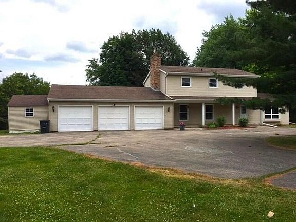 Attached 3 car garage and shed