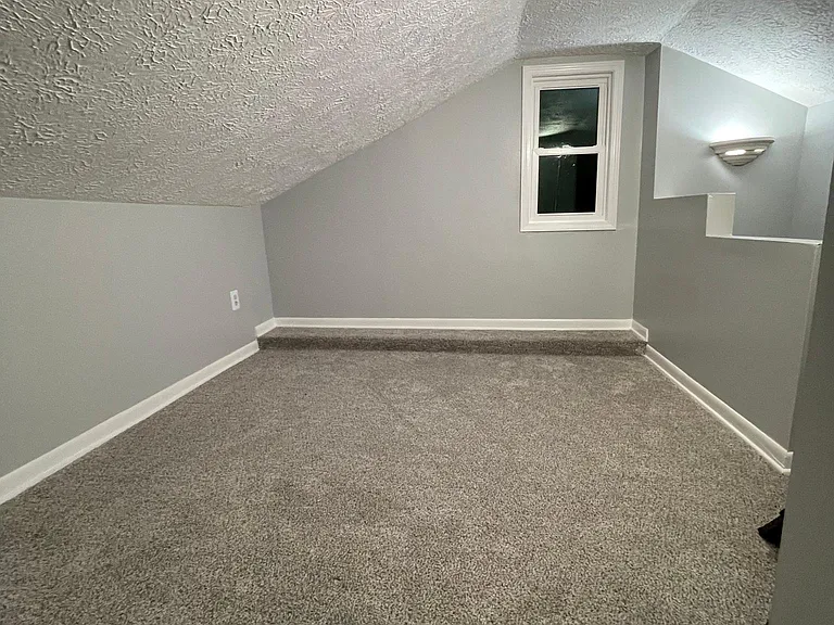 Right side of the loft, steps lead down to kitchen and laundry room.