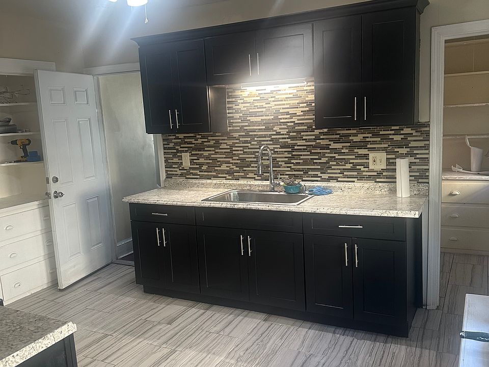 Kitchen has walk in pantry