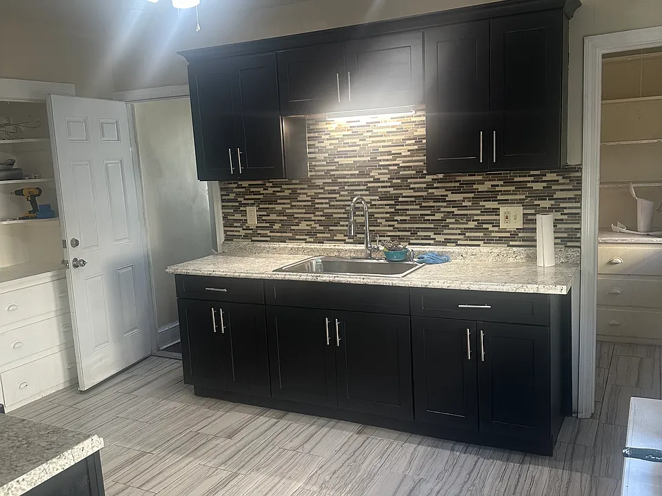 Kitchen has walk in pantry