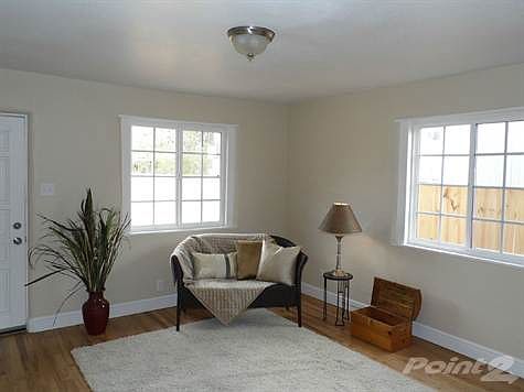 Welcome to your charming, cozy Living Room with beautiful hardwood floors!