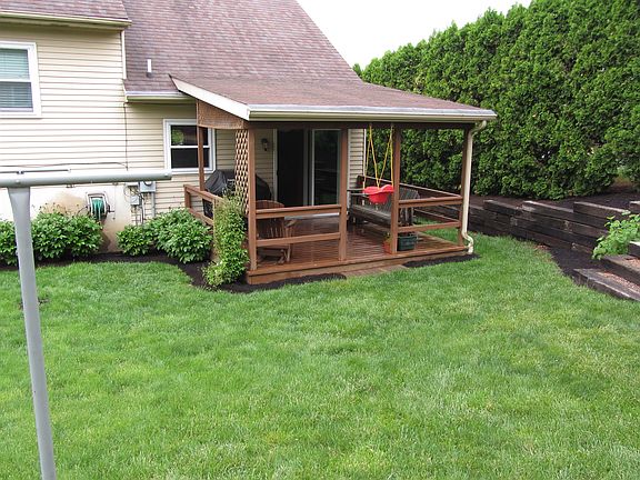 Back yard w/ covered deck