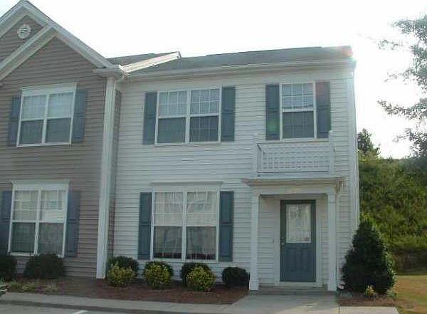 Front of the townhome (end unit) with dedicated parking!