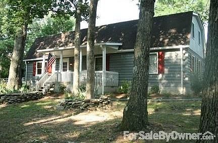 Front porch facing wooded acreage