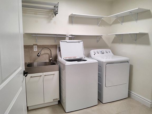Huge own laundry room.