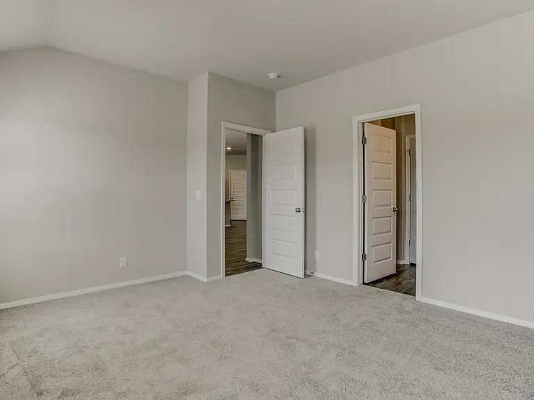 Inside master suite looking at bathroom and living room. Bedroom 1 of 4