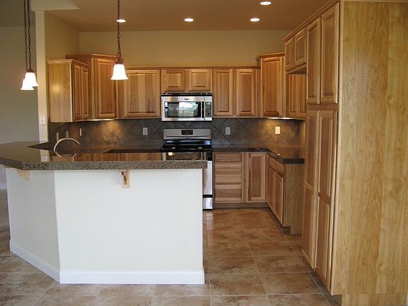 Gorgeous kitchen and breakfast bar with accent lighting