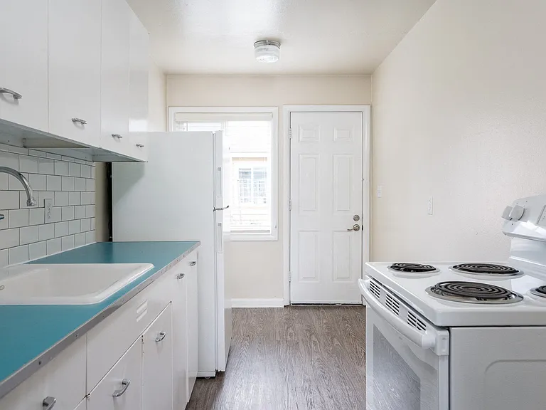 Clinton Court| Kitchen with White Appliances