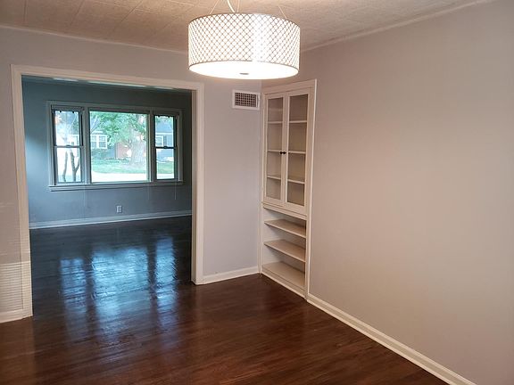 Dining room great for entertaining. Newly refinished hardwood floors, built in cabinets with awesome drum light fixture.