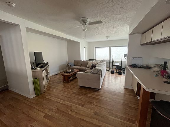 living room, kitchen to right