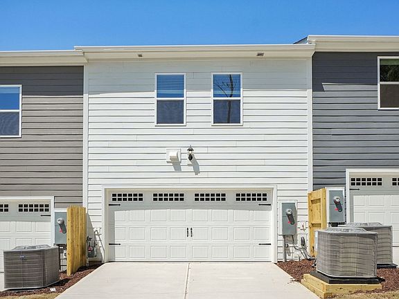 A two-car garage provides plenty of parking and storage space.