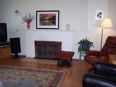 Living room w/ brick fireplace