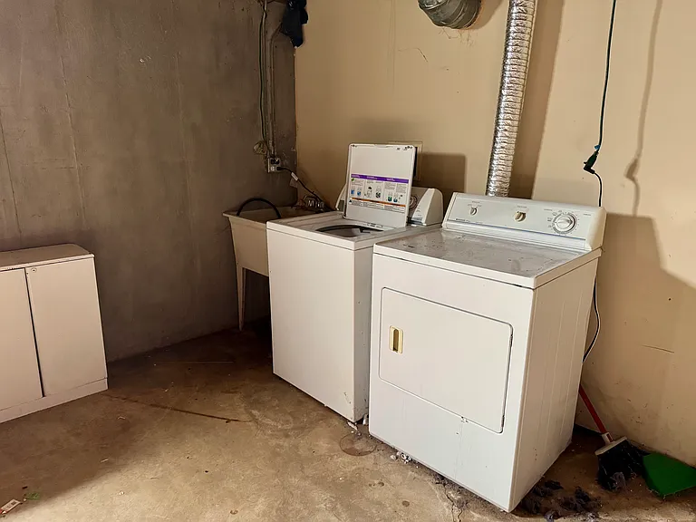Laundry area located in basement.