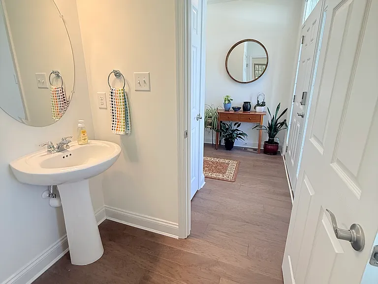 Another view of the half bathroom looking into the entry/foyer