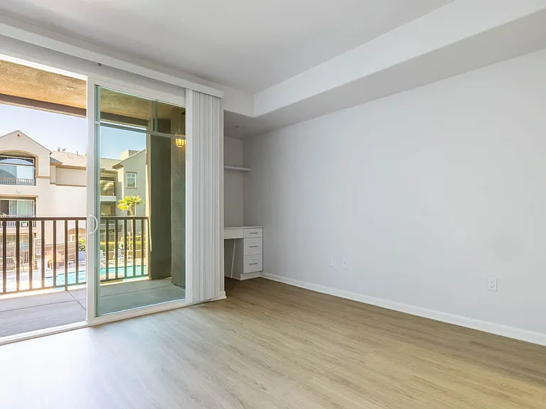 Bedroom with Balcony and Hard Surface Flooring