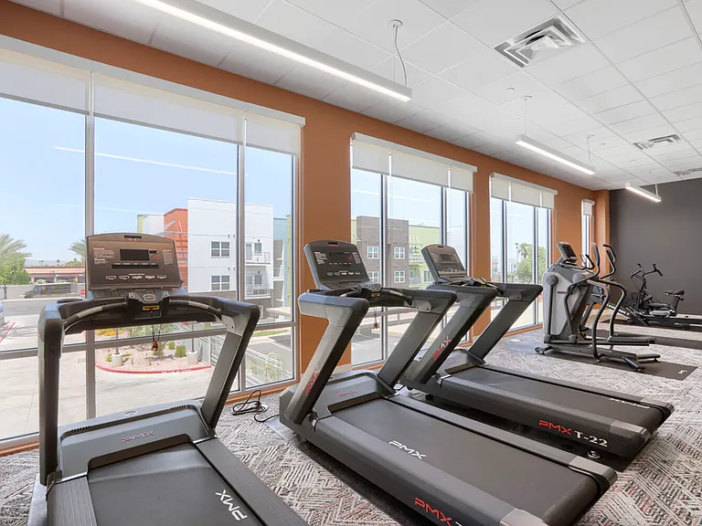 Cardio with a view. Our PMX treadmills, ellipticals, and rowing machines line a full wall of windows so your morning run comes with natural light and community views.