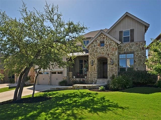 Beautiful exterior front of home with covered front porch.