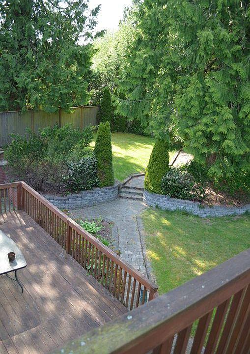 Upper and lower decks in private backyard