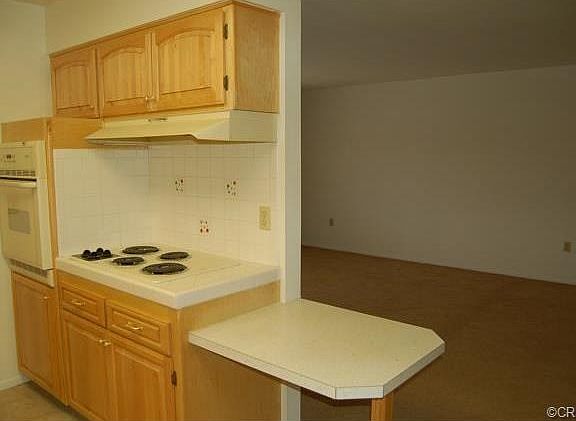 Newer appliances and snack bar open to living room/dining room