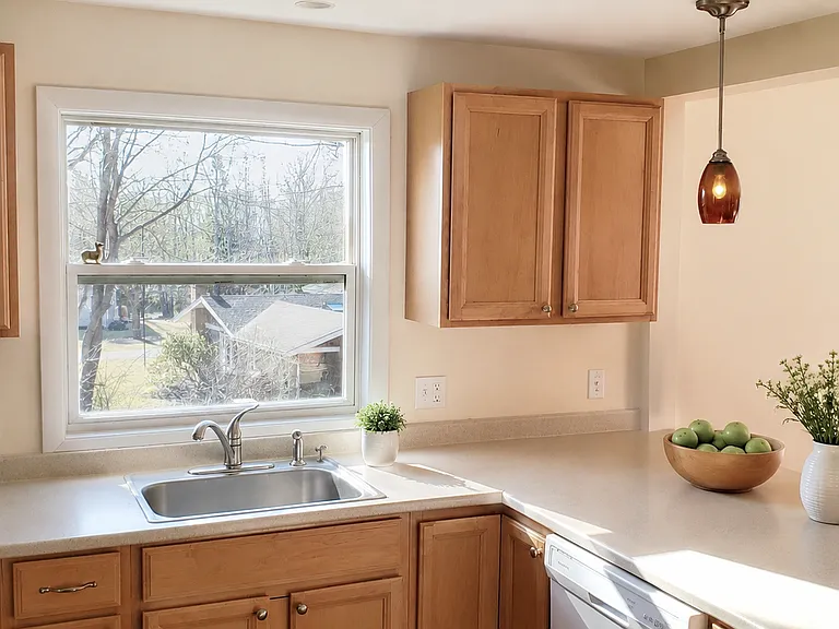 Living areas drenched with natural light. Lovely seating peninsula between kitchen & dining