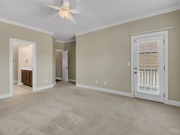 Large master bedroom includes private balcony