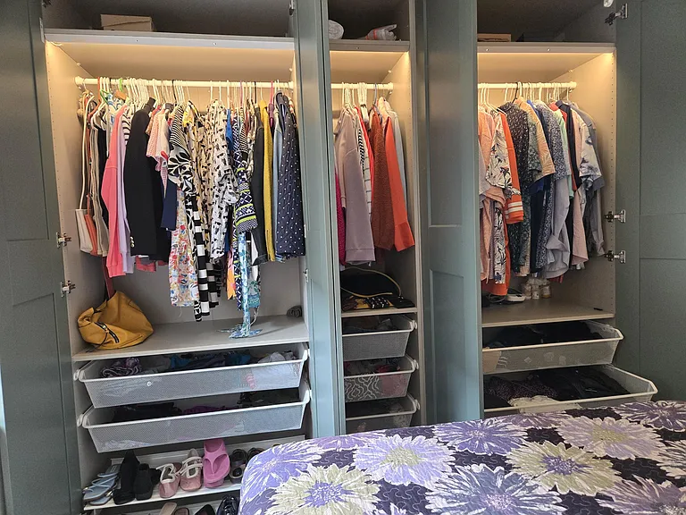"His and Her" closet and drawers w/ lights upon opening
