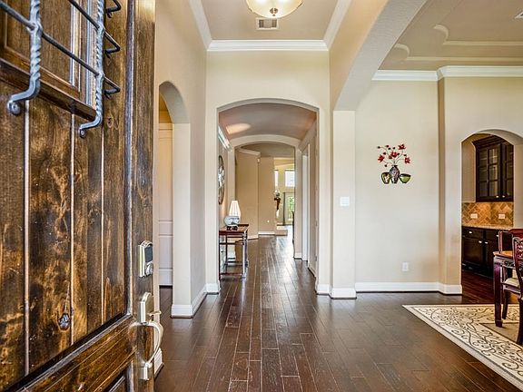 From the moment you enter the home you can appreciate the crown molding, rich 5'' hardwoods and nice high ceilings which stream in lots of natural light.