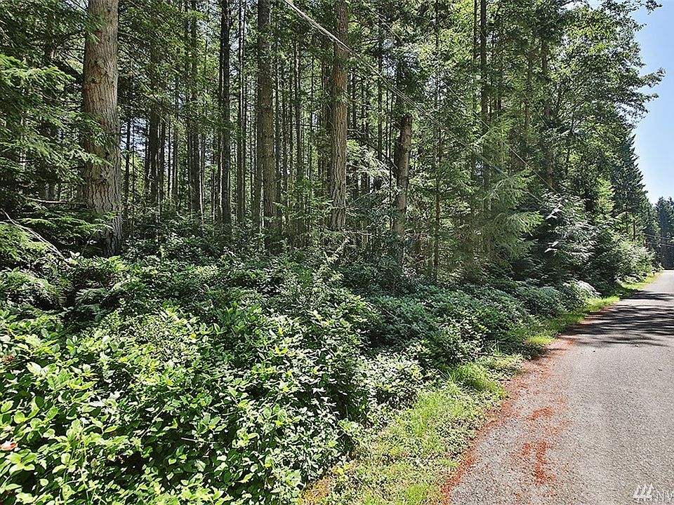 Welcome to Pinewood Circle, a short distance from Langley.  Just enough space for some privacy yet not too much land to tend.  A path is cleared through the lot.  Path is to the left of the mailboxes. 
