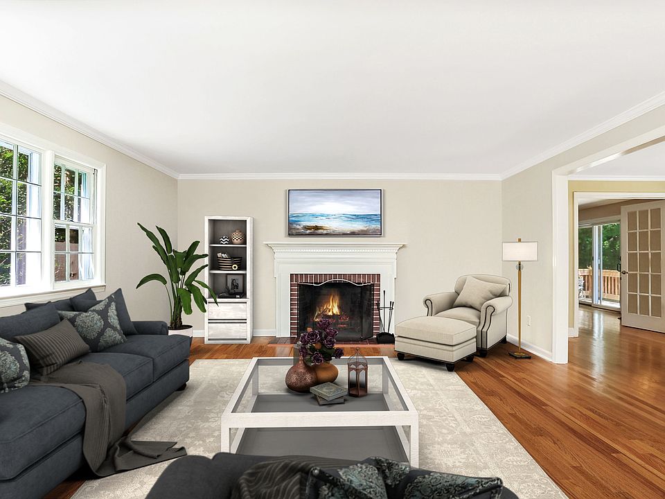 Beautiful colonial home with four fireplaces - family room, second living room, dining room and living space in the basement