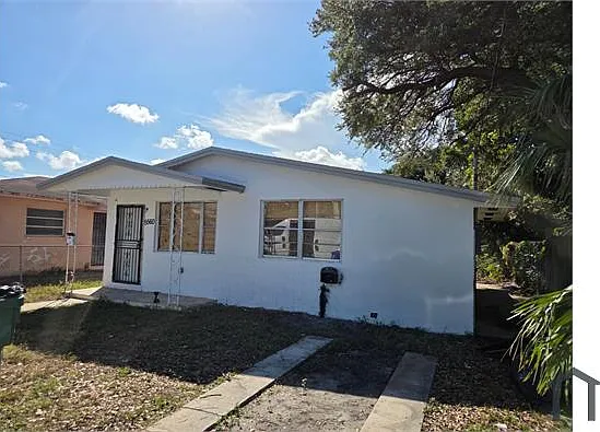 5560 NW 7th Ct — Photo 1