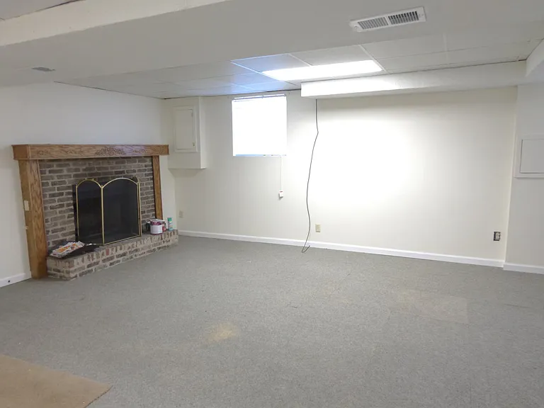 Rec Room - before new vinyl lank flooring was installed