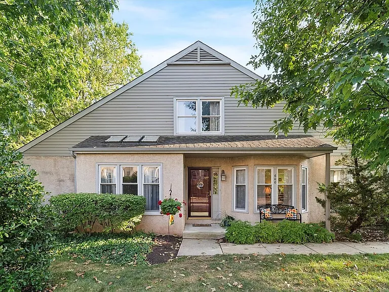 Front door view w/ small patio