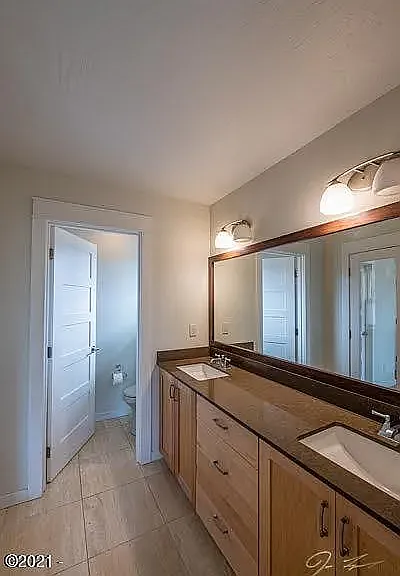 Double Sinks with Quartz Counters and Water Closet.
