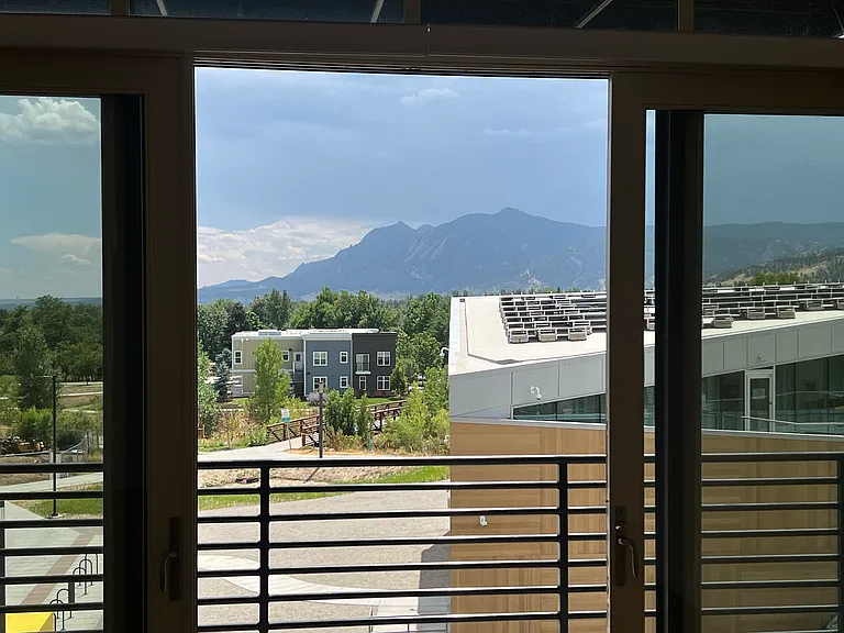 View from kitchen to Flatirons and Boulder