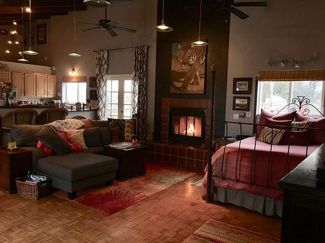 From entry door looking North East. French doors lead to rooftop deck (14' x 14') Kitchen area is to the left and loft area is above the bathroom, just above the kitchen.