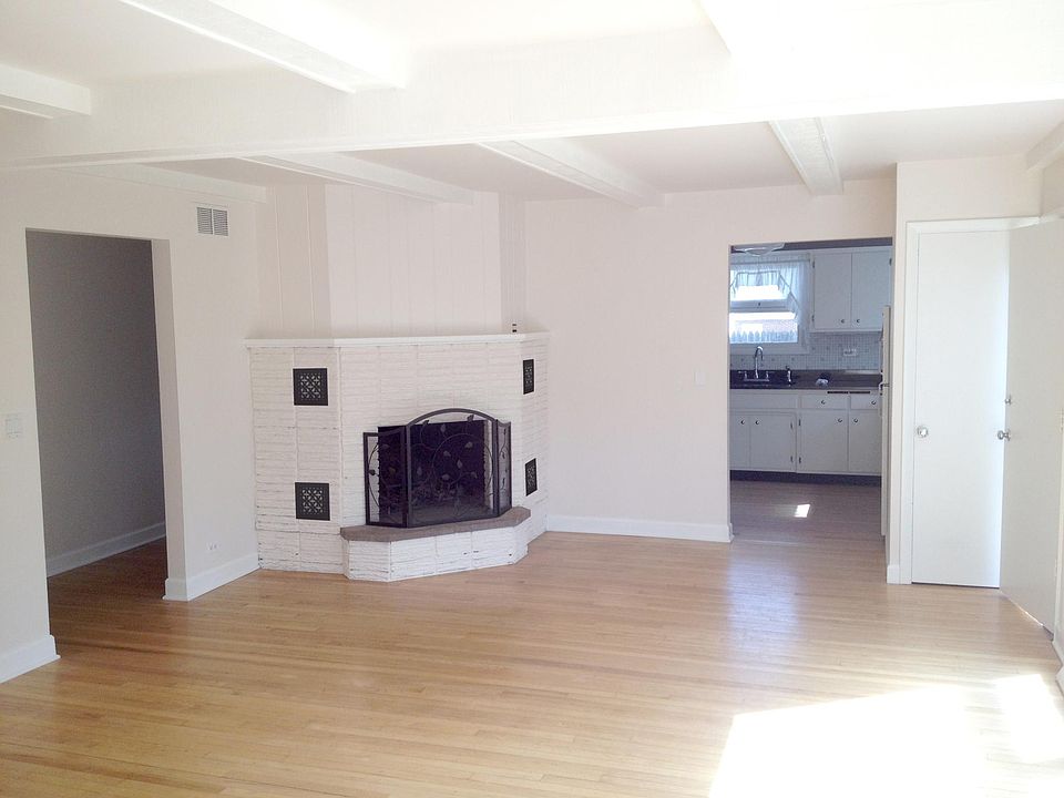 Living Room w beamed ceiling and fireplace
