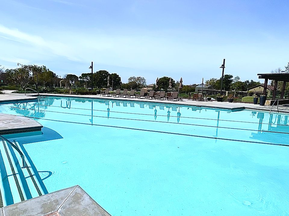 Community swimming pool with spa and fire place