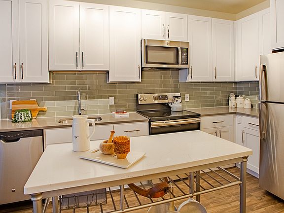 Chef-inspired kitchens outfitted with quartz counter tops and elegant islands
