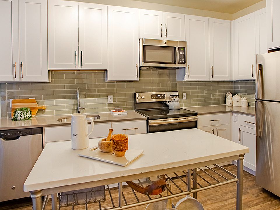 Chef-inspired kitchens outfitted with quartz counter tops and elegant islands