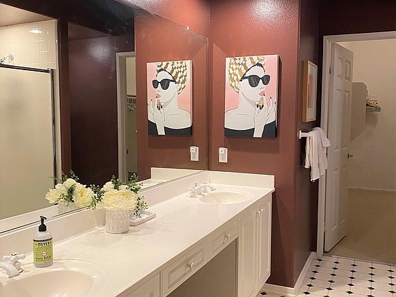 master bathroom has a large Roman tub and a standing shower