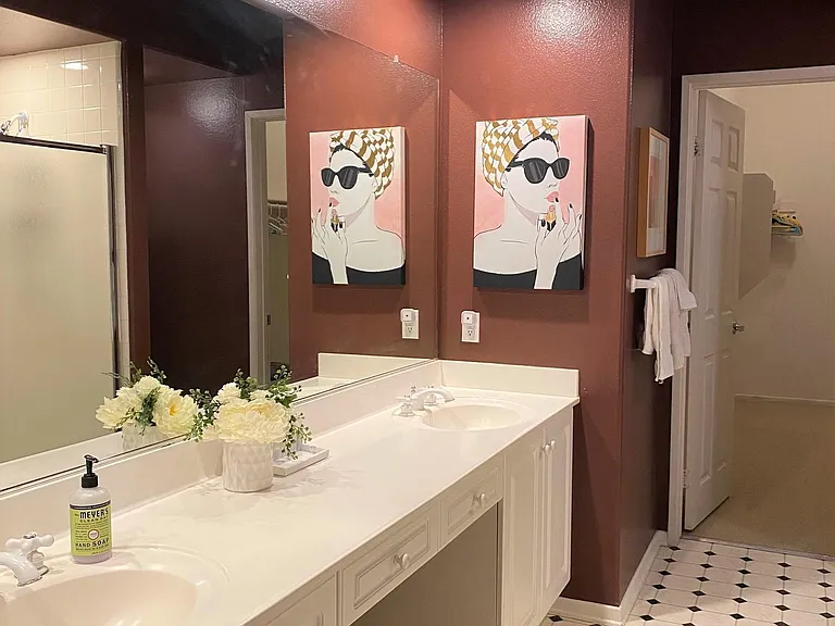 master bathroom has a large Roman tub and a standing shower