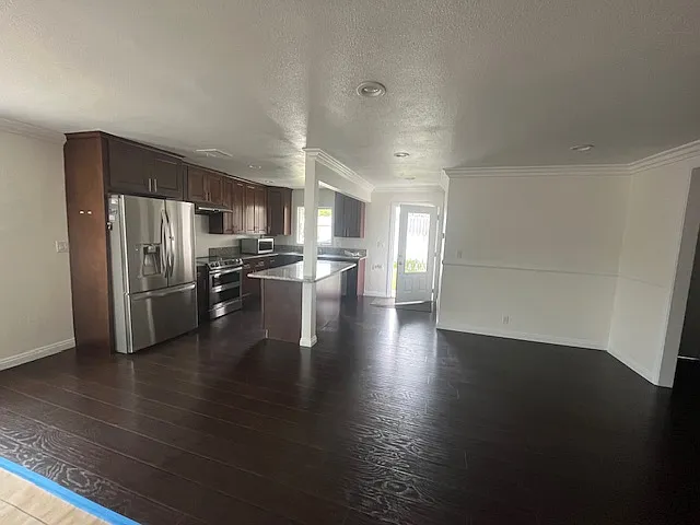 This is a more accurate color of the flooring and cabinets..