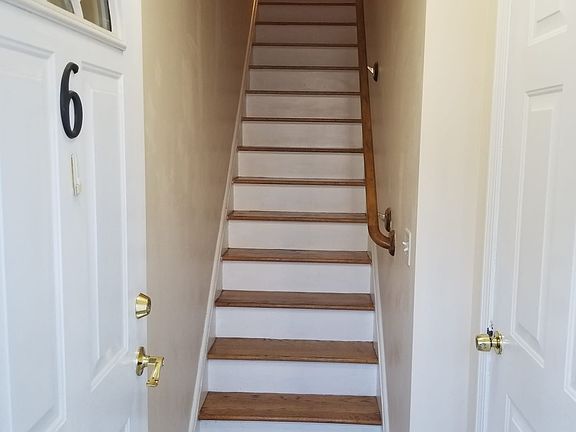 stairs leading to 1st floor; right door opens into 2-car garage