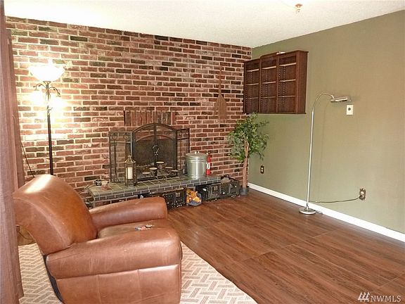 Living Room with cozy wood burning fireplace