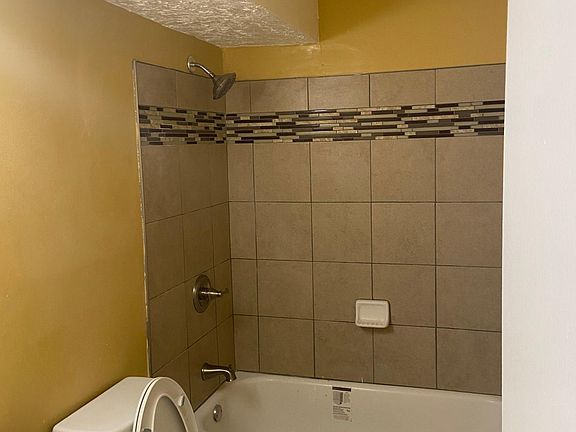 New tile and plumbing fixtures! Fresh paint!