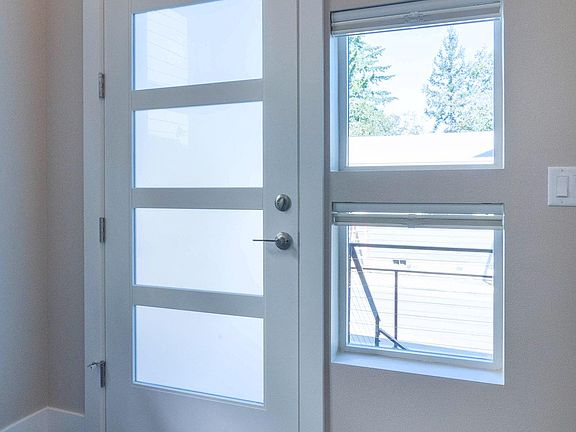 Bright, modern split level entry with luxury vinyl plank flooring throughout except for the stairs.